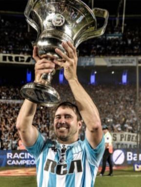 Eduardo Coudet lifting the championship trophy while at Racing Club.